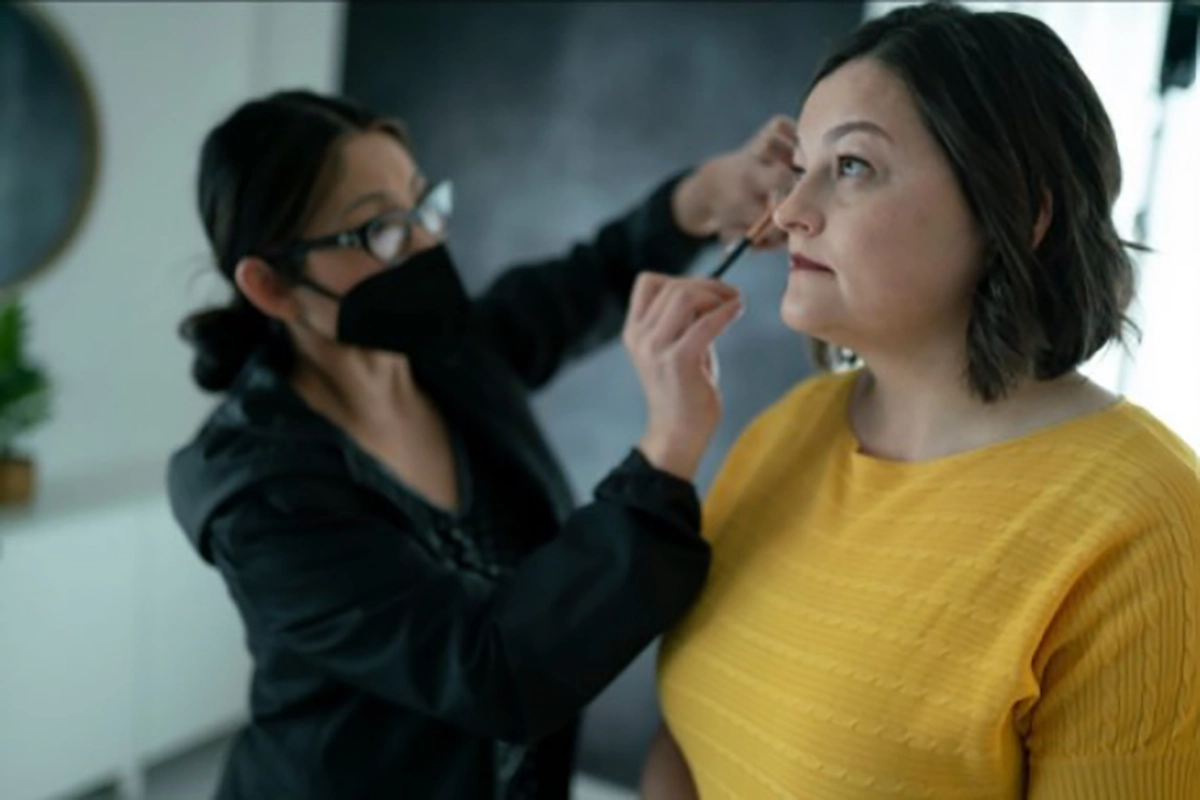 woman-getting-her-makeup-done-before-photoshoot