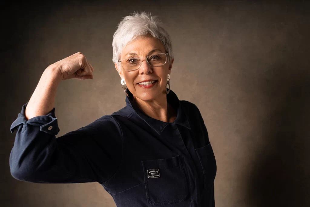 Senior-woman-flexing-her-bicep-smiling