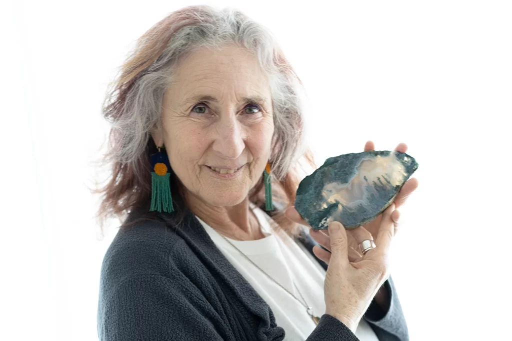 headshot-of-woman-holding-up-her-crystal
