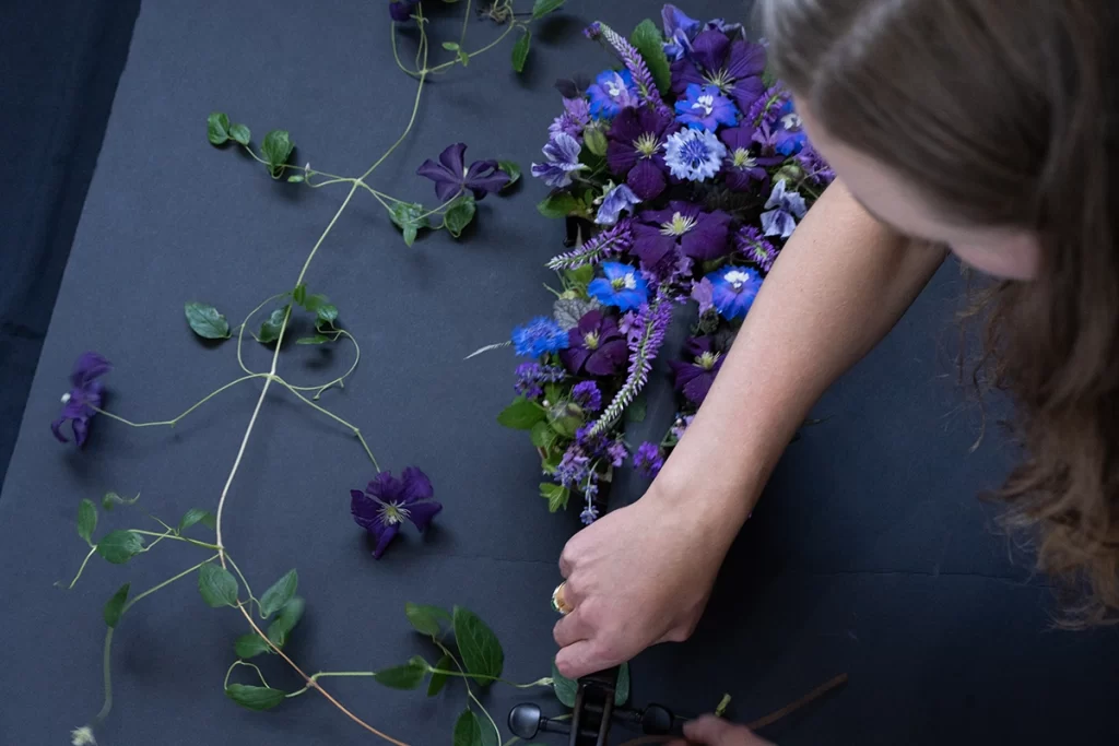 image-from-above-showing-woman-setting-up-floral-violin-prop