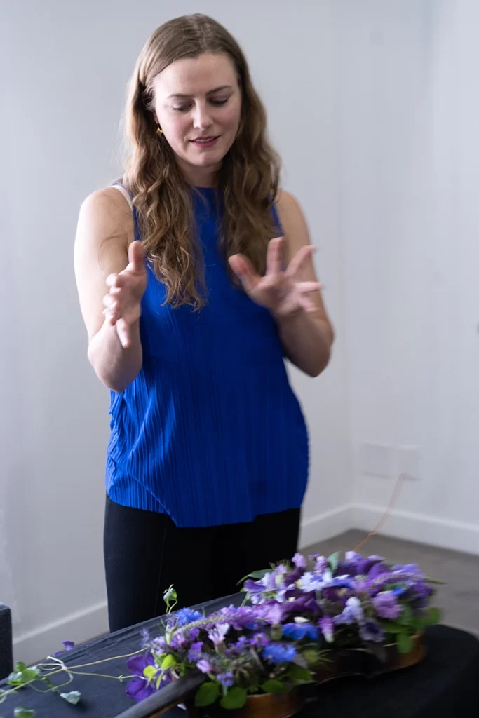 woman-explaining-the-floral-violin-prop