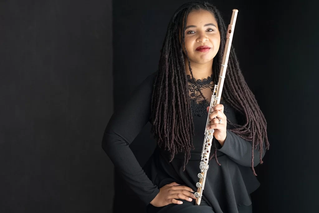 woman-in-all-black-concert-attire-posing-with-her-flute