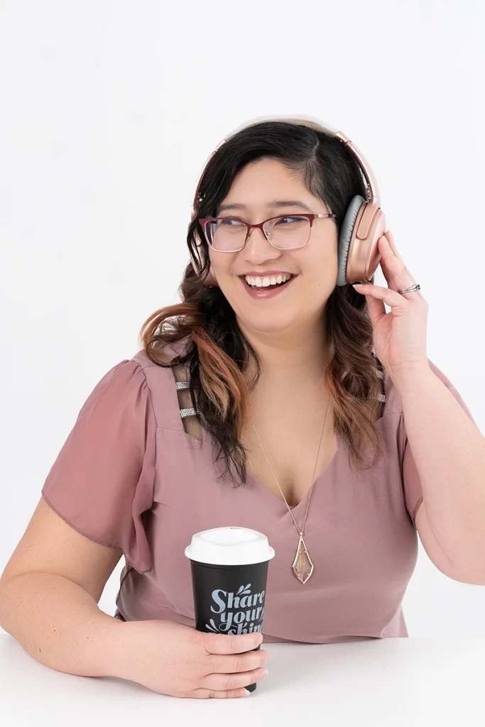 woman-with-coffee-wearing-headphones